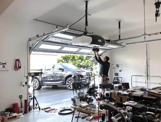Gainesville Garage Door Repair specialist installing smart garage door opener system in Gainesville home
