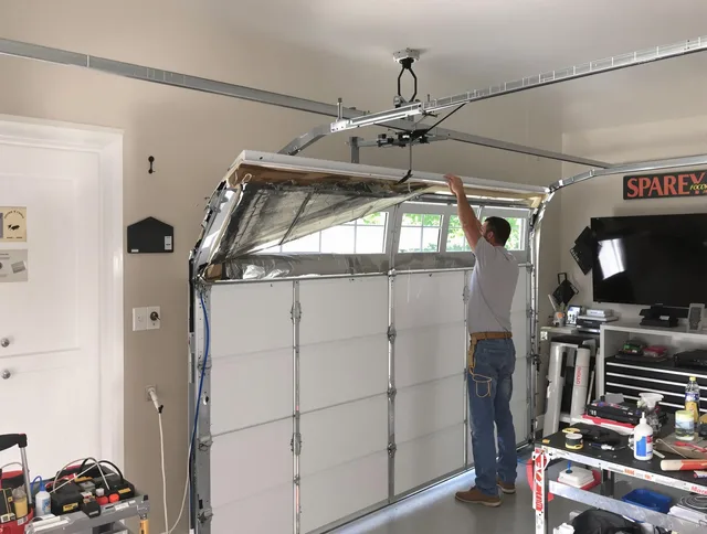 Garage door section replacement by Gainesville Garage Door Repair in Gainesville