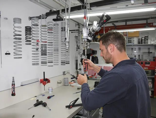 Gainesville Garage Door Repair safety certified technician performing precision spring replacement in Gainesville